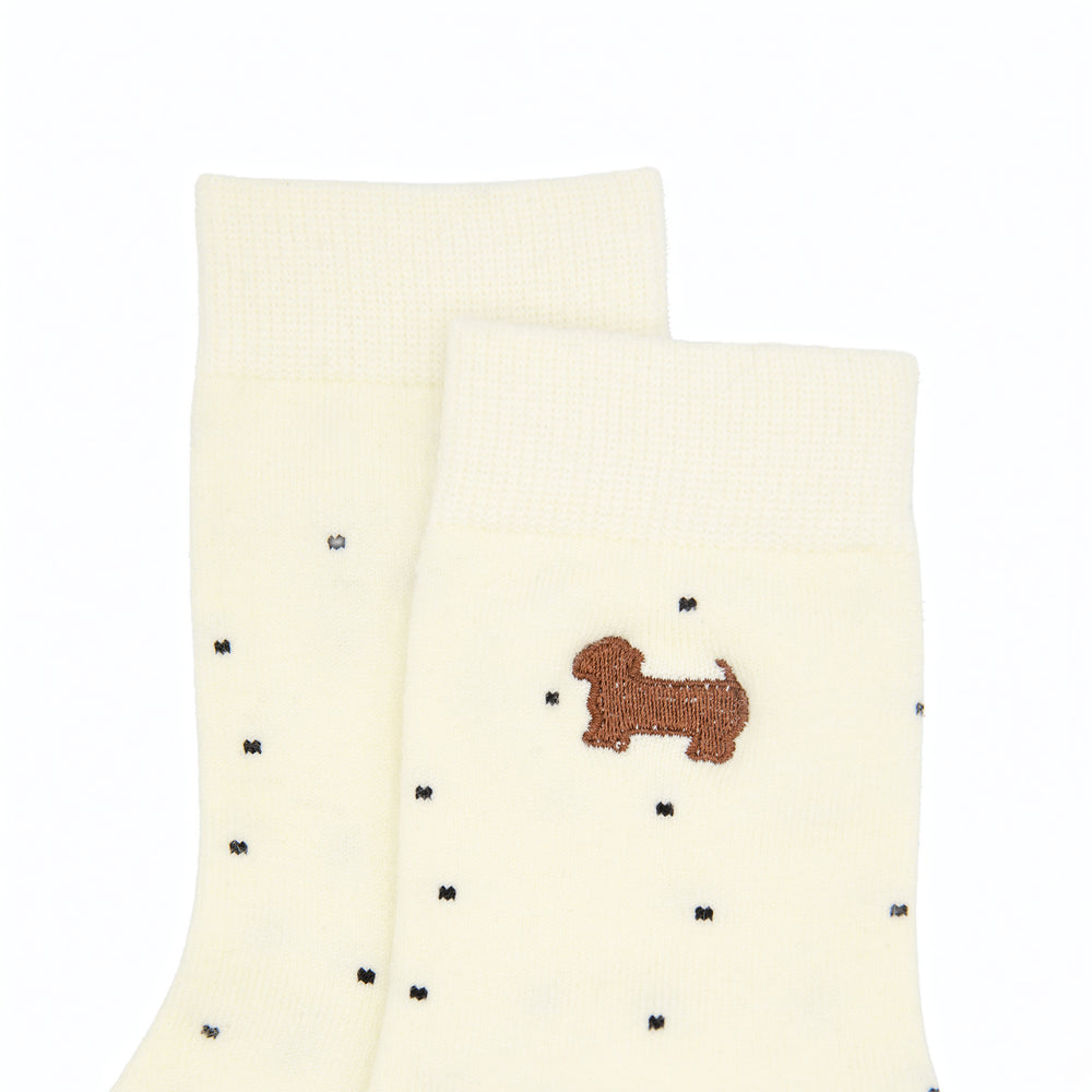 Cream polka dot socks with dog
